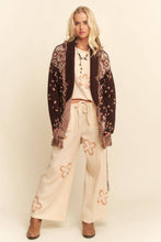 Load image into Gallery viewer, Chocolate brown tapestry-inspired jacquard knit cardigan with shawl collar, self-tie belt and multicolor fringe trim.