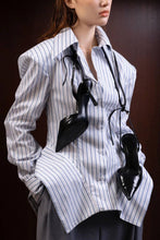 Load image into Gallery viewer, Close-up of blue-and-white pinstripe blouse highlighting the pointed collar, button-front closure, and dramatic puff sleeve construction.