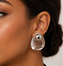 Load image into Gallery viewer, Clear transparent lucite statement earrings with rounded sculptural shapes and polished silver-tone sphere accents.