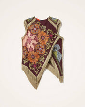 Load image into Gallery viewer, Model wearing a boho floral fringe scarf top with an asymmetrical handkerchief hem, vintage-inspired print in burgundy and olive tones, and decorative fringe trim.