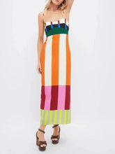 Load image into Gallery viewer, Woman wearing a colorful striped dress on a white background