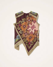 Load image into Gallery viewer, Model wearing a boho floral fringe scarf top with an asymmetrical handkerchief hem, vintage-inspired print in burgundy and olive tones, and decorative fringe trim.