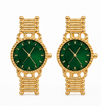 Load image into Gallery viewer, Gold statement earrings designed like miniature vintage watches with emerald-green faces, gold hands and bracelet-style detailing.