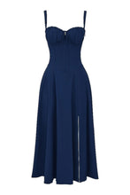 Load image into Gallery viewer, A model showcases a navy blue corset midi dress with a plait front, sleeveless design, and two shoulder straps, crafted from light, breathable fabric for a comfortable yet elegant look.