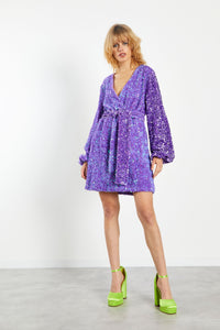 Glam Expressway’s Purple Sequin Dress is chic, feminine and glamorous! This fun sequin dress is fully lined, with a relaxed fit and a self tying belt. This elegant dress has a retro and modern feel at the same time. Wear this glamorous sequin dress when you want to stand out!