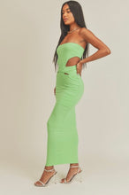 Load image into Gallery viewer, This Lime green strapless maxi dress is made from a soft and stretchy material that will conform to your curves. Its cutouts and strapless detail make for a sexy silhouette, perfect for a summer wedding or night out on the town. A solid dress with cutouts on the sides. This strapless dress has a tight cup fit and plenty of stretch. Model pictured is wearing a size small.