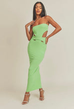Load image into Gallery viewer, This Lime green strapless maxi dress is made from a soft and stretchy material that will conform to your curves. Its cutouts and strapless detail make for a sexy silhouette, perfect for a summer wedding or night out on the town. A solid dress with cutouts on the sides. This strapless dress has a tight cup fit and plenty of stretch. Model pictured is wearing a size small.