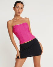 Load image into Gallery viewer, Add some sparkle to your party outfit with our Pink Rhinestone Corset Tube Top. This glamorous "going out top" comes in a pink stretch tailoring fabric, features a slim fit with a bandeau neckline and zipper fastening at the back. Finished with a rhinestone crystal trim detailing. Style Tip: Wear our Pink Rhinestone Corset Top with oversized cargo pants for chic city streetwear look or pair it with some tailored wide leg pants and strappy heels for a dressier moment.