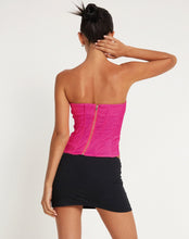 Load image into Gallery viewer, Add some sparkle to your party outfit with our Pink Rhinestone Corset Tube Top. This glamorous "going out top" comes in a pink stretch tailoring fabric, features a slim fit with a bandeau neckline and zipper fastening at the back. Finished with a rhinestone crystal trim detailing. Style Tip: Wear our Pink Rhinestone Corset Top with oversized cargo pants for chic city streetwear look or pair it with some tailored wide leg pants and strappy heels for a dressier moment.