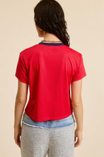 Load image into Gallery viewer, Unleash your sporty side with our Crop Jersey Tee Number 73! This baby tee blends comfort and style, featuring a soft jersey fabric that hugs your body just right. The bold number 73 adds a touch of athletic flair, making it perfect for casual outings or an active day out. Pair it with high-waisted jeans or your favorite shorts for a trendy, effortless look. Elevate your wardrobe with this must-have sporty staple!
