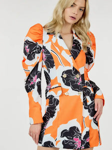 Glam Expressway's Orange puff sleeve Blazer Dress is a show stopper! This dress is orange and printed with black and white florals. This fun dress is double breasted with gold toned buttons and a pop of color for an elevated look. Wear this gorgeous and stylish dress to dinner parties and rooftops all Summer long!