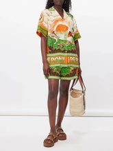 Load image into Gallery viewer, Elevate your summer style with the Peponi Tropical Shorts and Shirt Set. This vibrant ensemble features a stunning tropical island sunset print in shades of green, beige, white, brown, and orange. Perfect for warm weather, the breezy blouse and matching shorts capture the essence of an exotic getaway, making it a must-have for your wardrobe.
