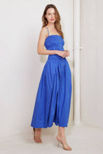 Load image into Gallery viewer, Woman wearing a blue dress against a white background
