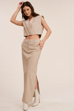 Load image into Gallery viewer, The beige slim fit maxi dress is the perfect basic piece transitioning effortlessly from day-to-night. This beige skirt features a classic all over pin stripe design that is both chic and timeless. The beige maxi skirt can easily go from a day at the office to a night on the town. With belt loops, front pockets and a button &amp; zipper closure at the front, the beige slim fit maxi skirt is wearable and comfortable. 
