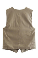 Load image into Gallery viewer, This Khaki vest and shorts set is a simple, classic and chic outfit. The khaki vest has side pockets and the matching shorts come with a brown woven adjustable belt. You can style this set with your favorite pair of sandals or sneakers. The Kahaki Vest &amp; Shorts Set gives a safari chic vibe. Perfect on its own or layered over a long sleeved top or sweater. This khaki set is perfect for your next adventure. Simply throw on this outfit and you&#39;re ready to go.

