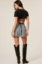 Load image into Gallery viewer, The Black Plaid Skort is giving 90&#39;s school girl but elevated! This chic and on trend skort has an elasticized back for a comfortable fit and exaggerated front pockets for a stylish twist. Wear this skort with the matching blazer (sold separately) for a polished and put-together look!
