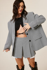 The Black Plaid Skort is giving 90's school girl but elevated! This chic and on trend skort has an elasticized back for a comfortable fit and exaggerated front pockets for a stylish twist. Wear this skort with the matching blazer (sold separately) for a polished and put-together look!