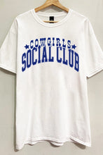 Load image into Gallery viewer, Saddle up in style with our White Cowgirl Social Club Graphic Tee. Crafted from 100% cotton for comfort and breathability, this short sleeve tee features an oversized &quot;COWGIRLS SOCIAL CLUB&quot; graphic, making a bold statement wherever you go. Whether you&#39;re hitting the rodeo or simply embracing the western spirit, this tee is sure to be a wardrobe favorite.
