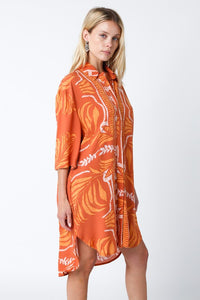 Light and breezy, this versatile shirt dress features a gorgeous orange and cream print, 3/4 sleeves and a button closure at the front. Perfect for running errands or vacation days at the beach. This versatile and chic shirt dress can be worn as a dress, a swimsuit cover up or a top. The styling possibilities are endless. 