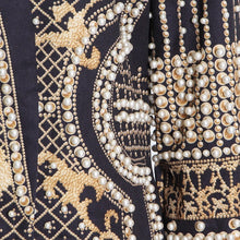 Load image into Gallery viewer, Elevate your wardrobe with our Gold Pearl Blazer, a striking black blazer adorned with luxurious pearls and a stunning gold design. This statement piece blends sophistication with bold glamour, making it perfect for turning heads at any occasion. Available in sizes S to 2XL, this versatile blazer is your go-to for a touch of elegance and drama. Wear it to command attention and make every moment unforgettable.
