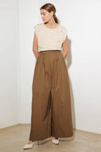 Load image into Gallery viewer, Elevate your wardrobe with these chic Wide-Leg Beige Pleated Pants! Designed with front and back pleats for a sophisticated touch, these solid woven pants feature convenient side pockets, a discreet side zipper closure, and a flowing wide-leg silhouette. Perfect for both office elegance and weekend outings, these versatile pants are a must-have for effortless style and comfort. Dress them up with heels or keep it casual with flats—the possibilities are endless!
