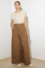 Load image into Gallery viewer, Elevate your wardrobe with these chic Wide-Leg Beige Pleated Pants! Designed with front and back pleats for a sophisticated touch, these solid woven pants feature convenient side pockets, a discreet side zipper closure, and a flowing wide-leg silhouette. Perfect for both office elegance and weekend outings, these versatile pants are a must-have for effortless style and comfort. Dress them up with heels or keep it casual with flats—the possibilities are endless!
