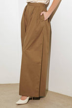 Load image into Gallery viewer, Elevate your wardrobe with these chic Wide-Leg Beige Pleated Pants! Designed with front and back pleats for a sophisticated touch, these solid woven pants feature convenient side pockets, a discreet side zipper closure, and a flowing wide-leg silhouette. Perfect for both office elegance and weekend outings, these versatile pants are a must-have for effortless style and comfort. Dress them up with heels or keep it casual with flats—the possibilities are endless!
