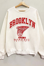 Load image into Gallery viewer, Score major style points in our Cream Brooklyn Sweatshirt! This oversized, vintage-athletic inspired crewneck features a cool &quot;Brooklyn Basketball&quot; graphic. Soft, comfy, and perfect for a laid-back look!
