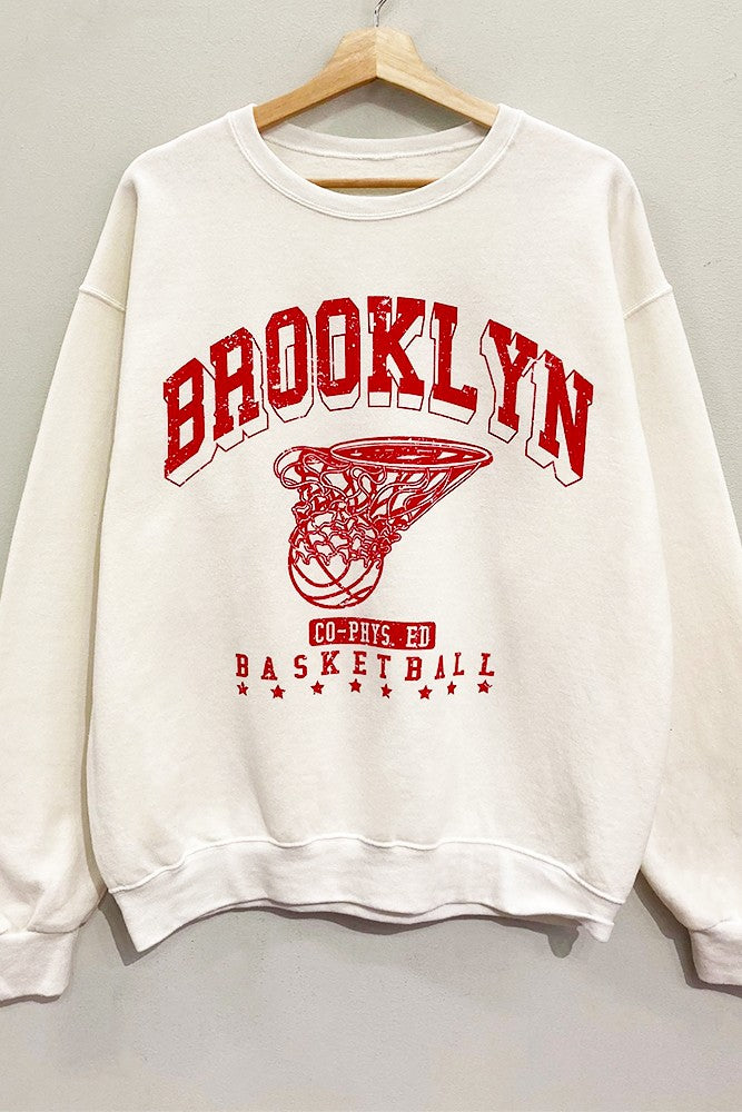 Score major style points in our Cream Brooklyn Sweatshirt! This oversized, vintage-athletic inspired crewneck features a cool 