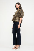 Load image into Gallery viewer, This Leopard Denim Blouse with Front Ties is a statement piece that’s as fierce as it is versatile. Perfect for creating bold, fashion-forward looks.
