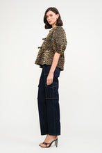 Load image into Gallery viewer, This Leopard Denim Blouse with Front Ties is a statement piece that’s as fierce as it is versatile. Perfect for creating bold, fashion-forward looks.
