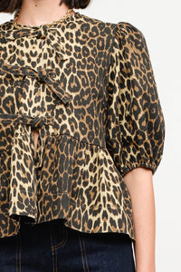 This Leopard Denim Blouse with Front Ties is a statement piece that’s as fierce as it is versatile. Perfect for creating bold, fashion-forward looks.