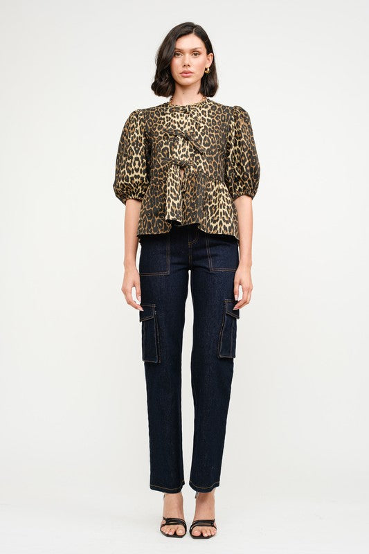 This Leopard Denim Blouse with Front Ties is a statement piece that’s as fierce as it is versatile. Perfect for creating bold, fashion-forward looks.