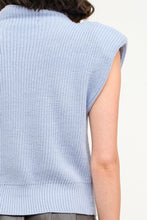 Load image into Gallery viewer, Stay effortlessly chic in our Light Blue Knit Sleeveless Sweater! This stylish piece features a soft knit design in a dreamy shade of blue, perfect for layering or wearing solo. With its versatile, elevated look, it’s a wardrobe essential for any season. For long-lasting wear, hand wash cold and line dry. Available now in sizes S - L!
