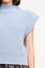 Load image into Gallery viewer, Stay effortlessly chic in our Light Blue Knit Sleeveless Sweater! This stylish piece features a soft knit design in a dreamy shade of blue, perfect for layering or wearing solo. With its versatile, elevated look, it’s a wardrobe essential for any season. For long-lasting wear, hand wash cold and line dry. Available now in sizes S - L!
