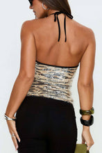 Load image into Gallery viewer, Back view of women's zebra print sequin halter top featuring an open upper back, adjustable black neck ties, and shimmering animal print fabric.
