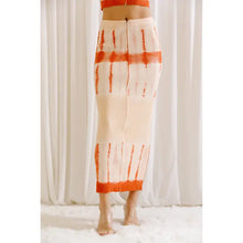 Load image into Gallery viewer, This tie dyed maxi skirt is a must-have for summer. With an orange and cream color scheme, this pencil skirt features a flattering silhouette, high waist and fitted body. This pencil skirt is perfect for your favorite day parties or hang outs in the summer time and throughout the year. Our tie dyed maxi pencil skirt is the perfect blend of casual and chic! 
