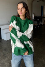 Load image into Gallery viewer, Wrap yourself in cozy style with this Green &amp; Cream Color Block Knit Sweater. Designed with a relaxed fit and a classic crew neck, it features a soft, medium-weight cable knit that adds texture and warmth. The all-over color block pattern offers a modern twist on a timeless piece, making it an effortless addition to any casual outfit. True to size, this sweater is perfect for layering or wearing solo for a chic, laid-back look.
