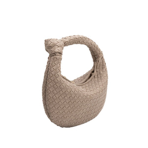 Now in vegan suede, the Woven Leather Mushroom Round Bag continues to be a crowd favorite among trendsetters and lovers of cruelty-free fashion. This utterly luxe yet eco-friendly top-handle handbag is made with recycled vegan suede, so you can show off your style in a sustainable way.