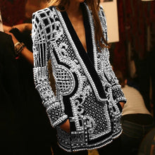 Load image into Gallery viewer, Step up your style game with our Silver Pearl Blazer, a stunning black blazer embellished with elegant pearls and a shimmering silver design. This statement piece exudes modern sophistication and adds an eye-catching flair to any look. Available in sizes S to 2XL, it&#39;s the perfect blend of timeless elegance and bold luxury. Make a lasting impression with every wear, whether you&#39;re heading to a chic event or making a fashion-forward entrance.
