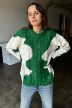 Load image into Gallery viewer, Wrap yourself in cozy style with this Green &amp; Cream Color Block Knit Sweater. Designed with a relaxed fit and a classic crew neck, it features a soft, medium-weight cable knit that adds texture and warmth. The all-over color block pattern offers a modern twist on a timeless piece, making it an effortless addition to any casual outfit. True to size, this sweater is perfect for layering or wearing solo for a chic, laid-back look.
