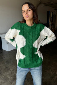 Wrap yourself in cozy style with this Green & Cream Color Block Knit Sweater. Designed with a relaxed fit and a classic crew neck, it features a soft, medium-weight cable knit that adds texture and warmth. The all-over color block pattern offers a modern twist on a timeless piece, making it an effortless addition to any casual outfit. True to size, this sweater is perfect for layering or wearing solo for a chic, laid-back look.