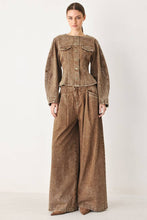 Load image into Gallery viewer, Women's vintage-washed brown denim jacket with a collarless round neckline, button front, chest pockets and sculpted fitted waist.

