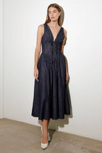 Load image into Gallery viewer, Turn heads in this elegant Solid Denim Corset Midi Dress! Featuring a deep V-neckline and sleeveless design, this dress is all about understated sophistication. The front tie detail and contouring waist accentuate your shape, while the flowing full skirt adds a touch of timeless charm. Perfect for dates, brunches, or evenings out, this versatile midi dress is a must-have for your wardrobe!
