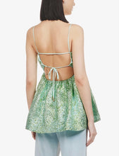 Load image into Gallery viewer, Introducing our Green Jacquard Peplum Top – a stylish and versatile wardrobe essential. Crafted from a luxurious jacquard fabric, this peplum top features self-tie straps for a customizable fit and a chic straight neckline. Elevate your look with this on-trend and sophisticated Green Jacquard Peplum Top, perfect for any occasion.
