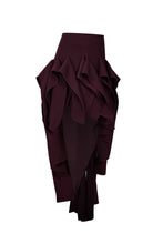 Load image into Gallery viewer, Burgundy asymmetric twill mini skirt featuring cascading sculptural ruffles and a dramatic elongated side hem on a white background.
