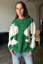 Load image into Gallery viewer, Wrap yourself in cozy style with this Green &amp; Cream Color Block Knit Sweater. Designed with a relaxed fit and a classic crew neck, it features a soft, medium-weight cable knit that adds texture and warmth. The all-over color block pattern offers a modern twist on a timeless piece, making it an effortless addition to any casual outfit. True to size, this sweater is perfect for layering or wearing solo for a chic, laid-back look.
