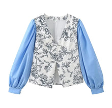 Load image into Gallery viewer, Introducing our Blue Puff Sleeved Floral Paneled Blouse – where chic meets elegance. Featuring a flattering V-neck and stylish puff sleeves, this blouse exudes sophistication with every detail. Perfect for any occasion, it’s a must-have addition to your wardrobe. Shop now before they’re gone!
