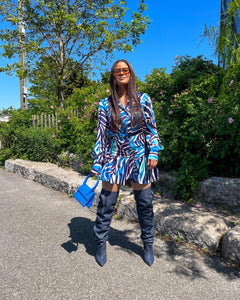 The Blue Ruched Shirt Dress is beautiful and chic with a feminine blue and white pattern, volume sleeves and ruching on the tummy area for a flattering fit. Wear this stylish dress for a fun, flirty and elegant look.