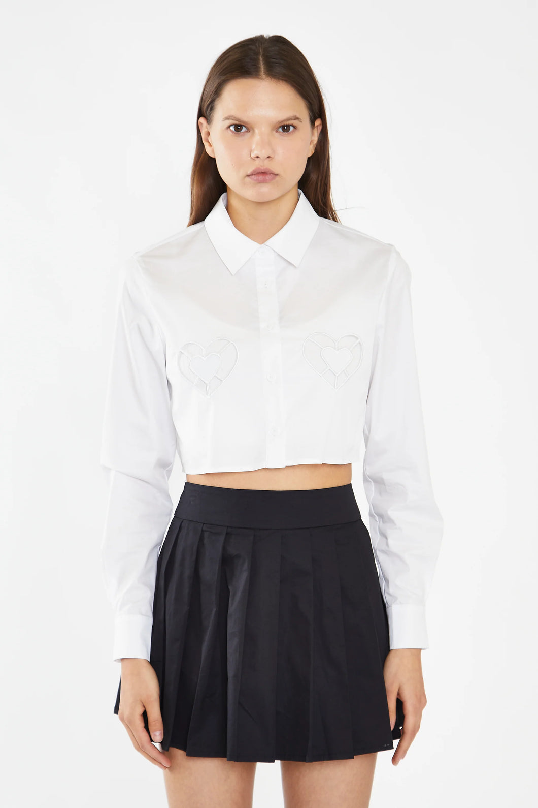 Introducing our Glamorous Women's White Heart Cut-Out Crop Button Down Shirt, the perfect choice to make a bold and stylish statement at any event! This ultra-cute, cropped button-down is designed to elevate your fashion game and make you the heart of the party. Crafted with attention to detail, the shirt features a chic heart-shaped cut-out that adds a playful and romantic touch to your look.